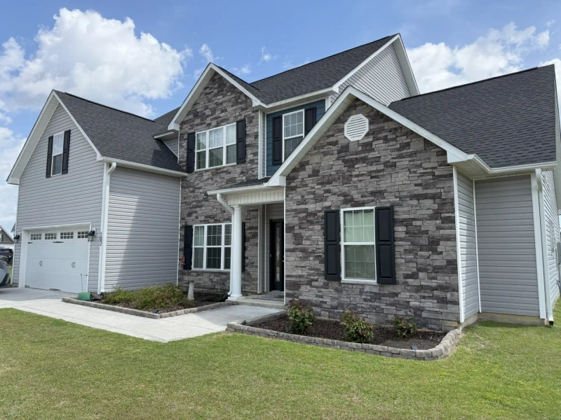 Professional pressure washing service cleaning a beachfront home on Bogue Banks in Emerald Isle NC