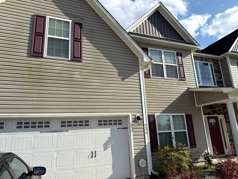 Professional pressure washing service cleaning a home in Swansboro NC