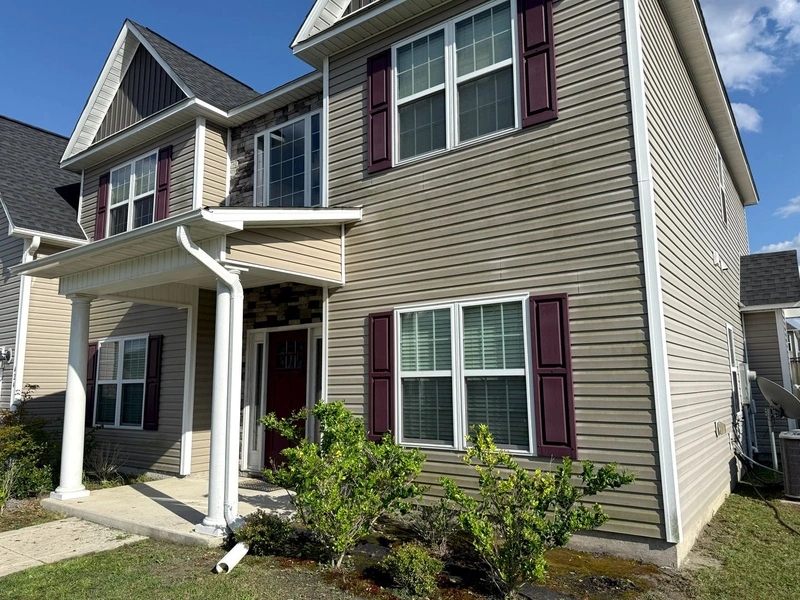 Professional pressure washing service cleaning a home in Richlands NC