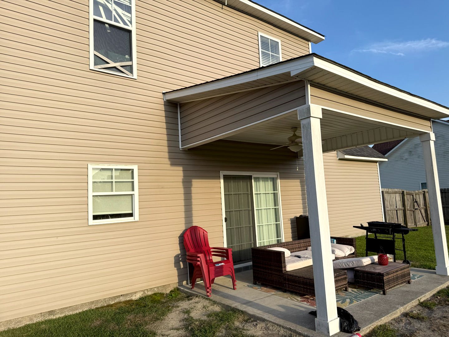 Exterior house pressure washing transformed dirty vinyl siding to a clean, refreshed look, enhancing curb appeal.