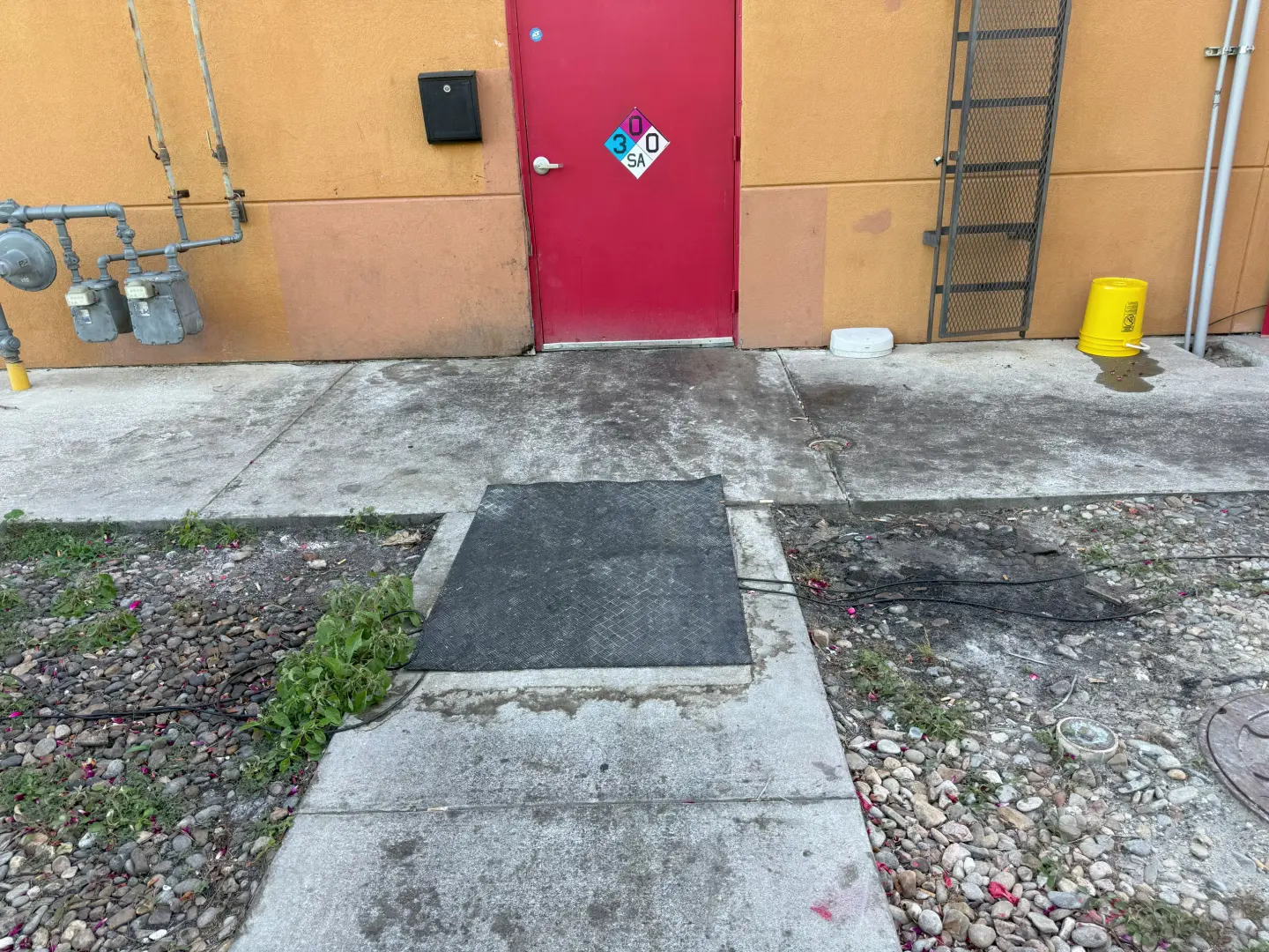 Pressure washing clears dirt and debris from a concrete pathway, enhancing its cleanliness and appearance.