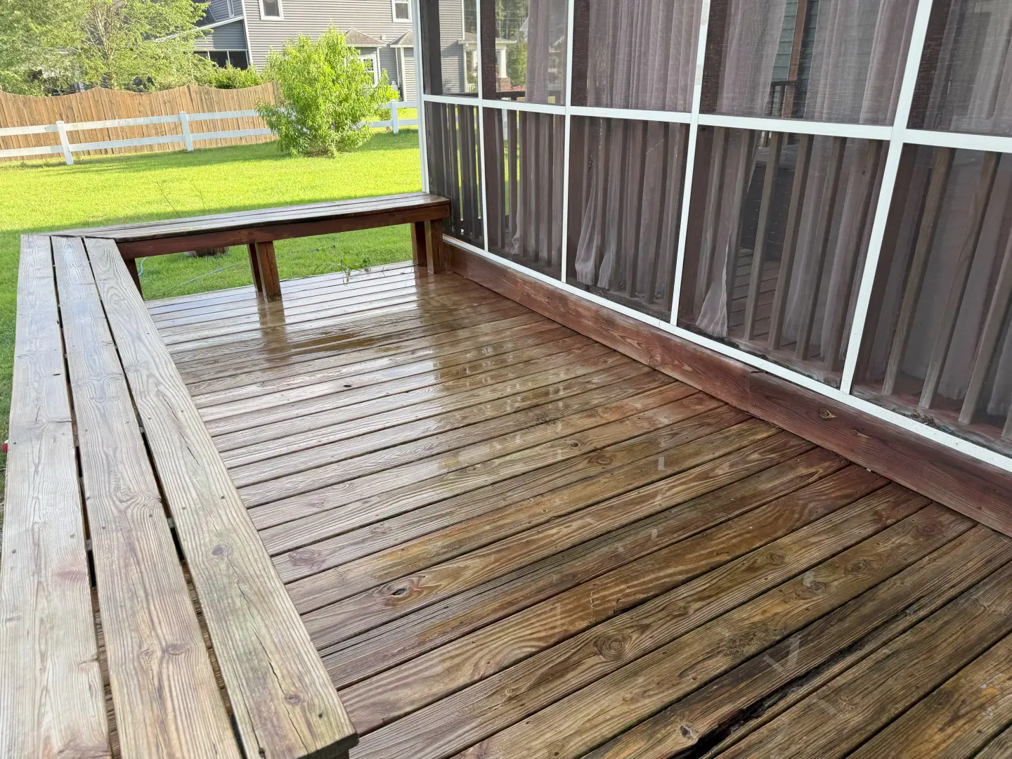 Freshly cleaned wooden deck showcasing a sparkling surface and enhanced grain detail after pressure washing.