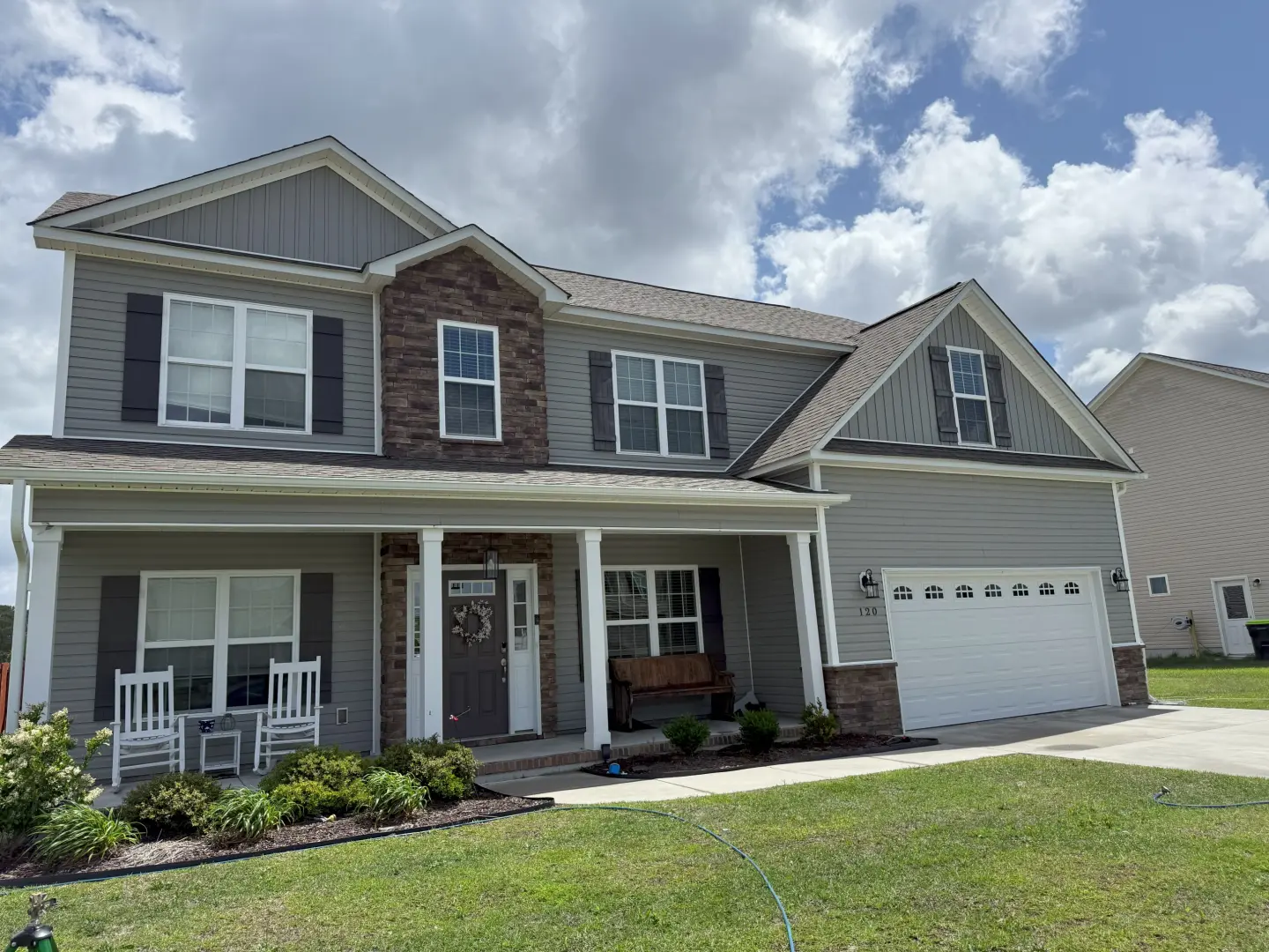 Pressure washing a home's exterior reveals a clean, rejuvenated surface, enhancing curb appeal and brightness.