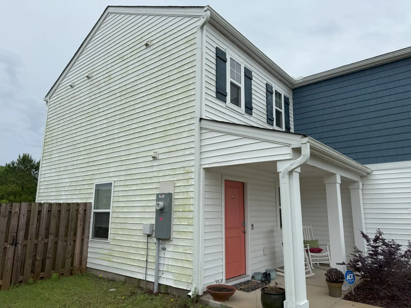 Before-and-after pressure washing of a house's exterior, removing dirt and grime for a refreshed appearance.