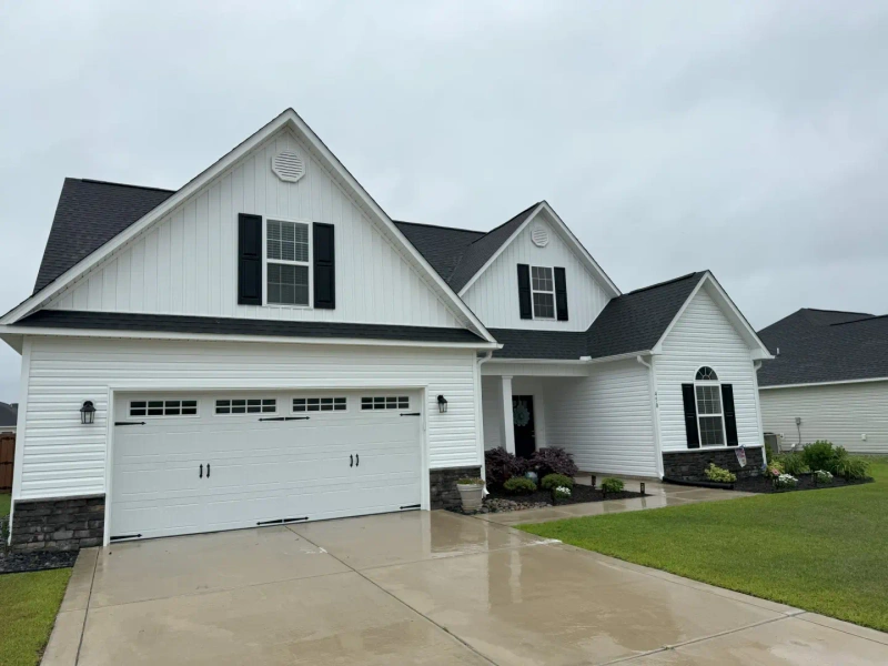 Professional pressure washing service cleaning a home in Morehead City NC
