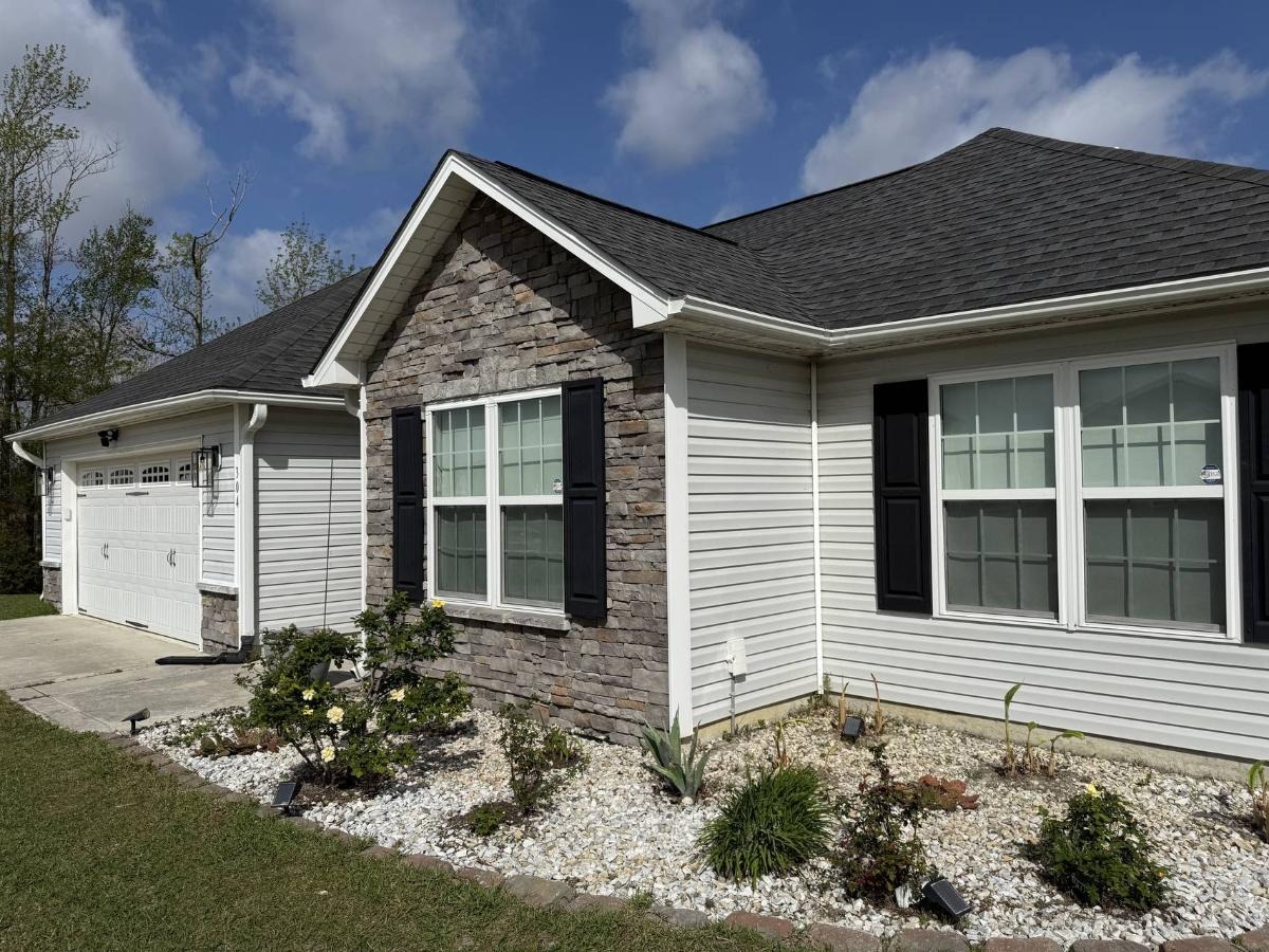 Professional house washing service removing dirt and algae from Jacksonville NC home