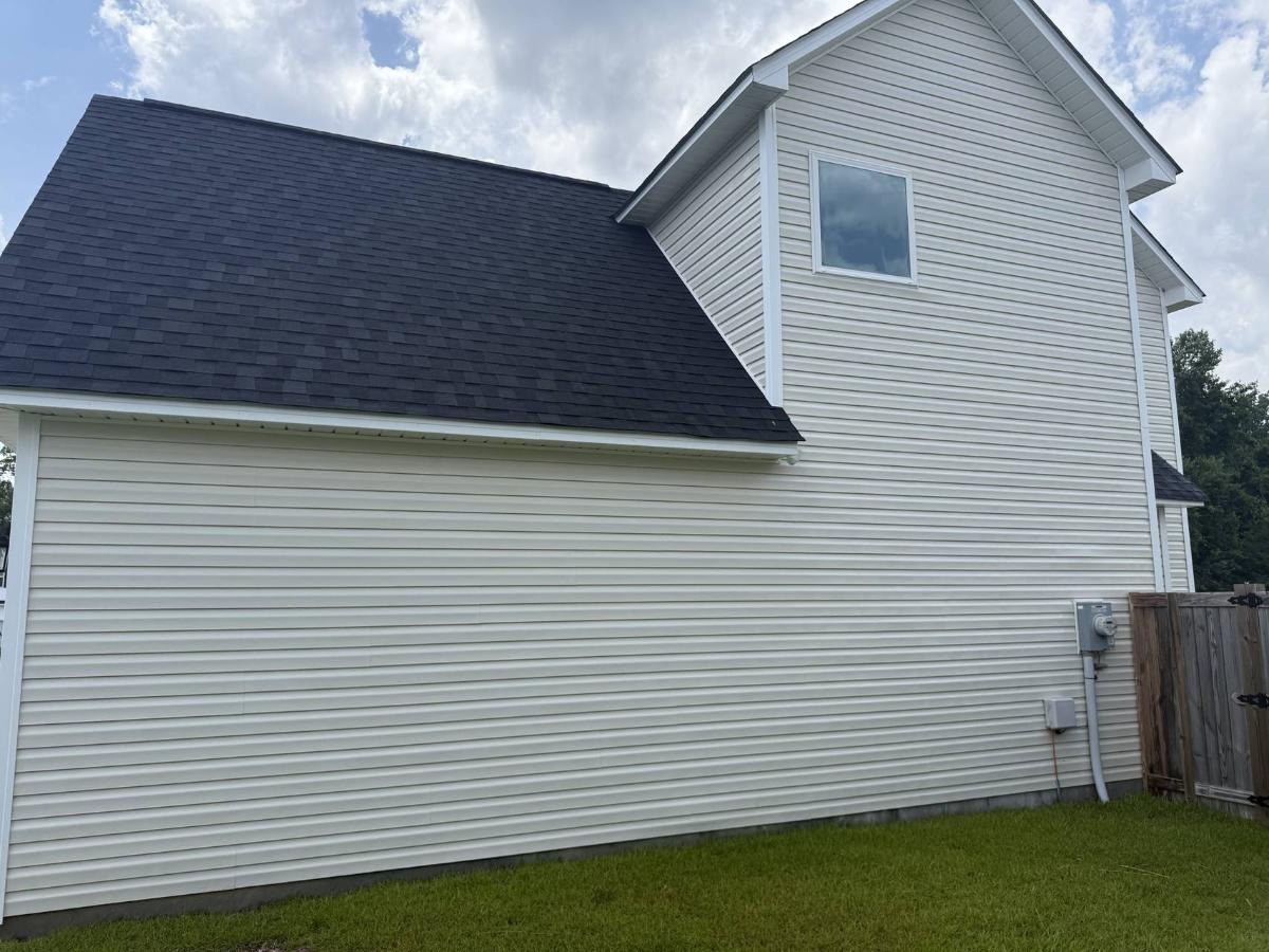 Safe roof cleaning service removing black algae streaks without damage