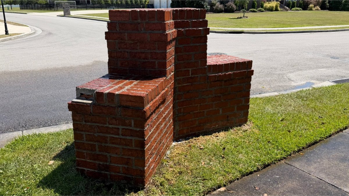 Brick column at a street entrance after cleaning