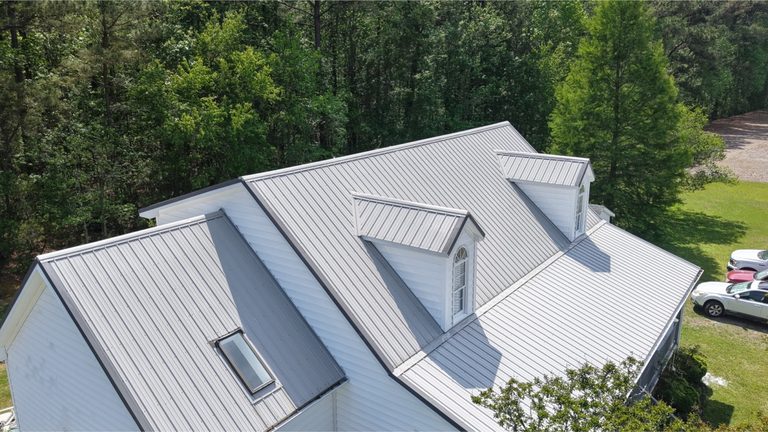 The same metal roof clean and uniform after soft washing