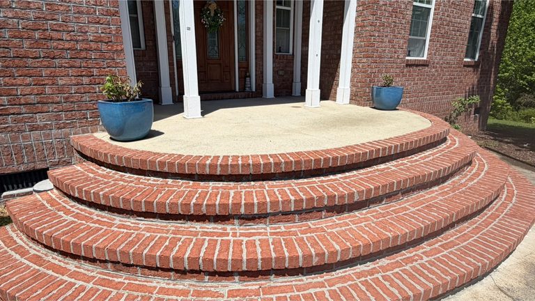 The same brick steps and treads cleaned to an even finish