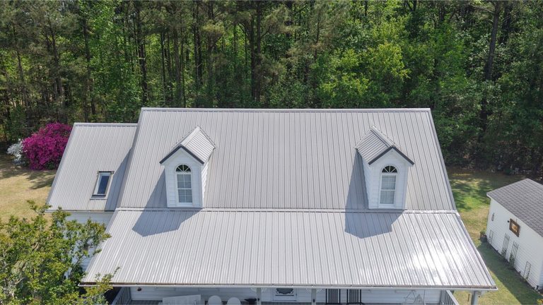 Metal roof and dormers from above after cleaning
