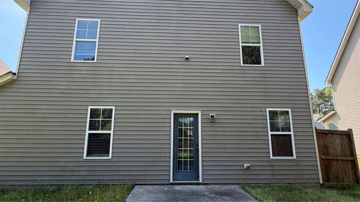 Side elevation with heavy shade staining before cleaning