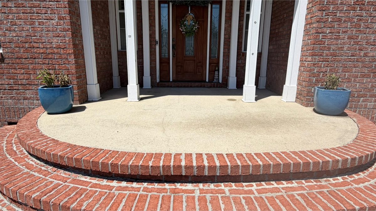 Brick porch and rounded entry steps after cleaning