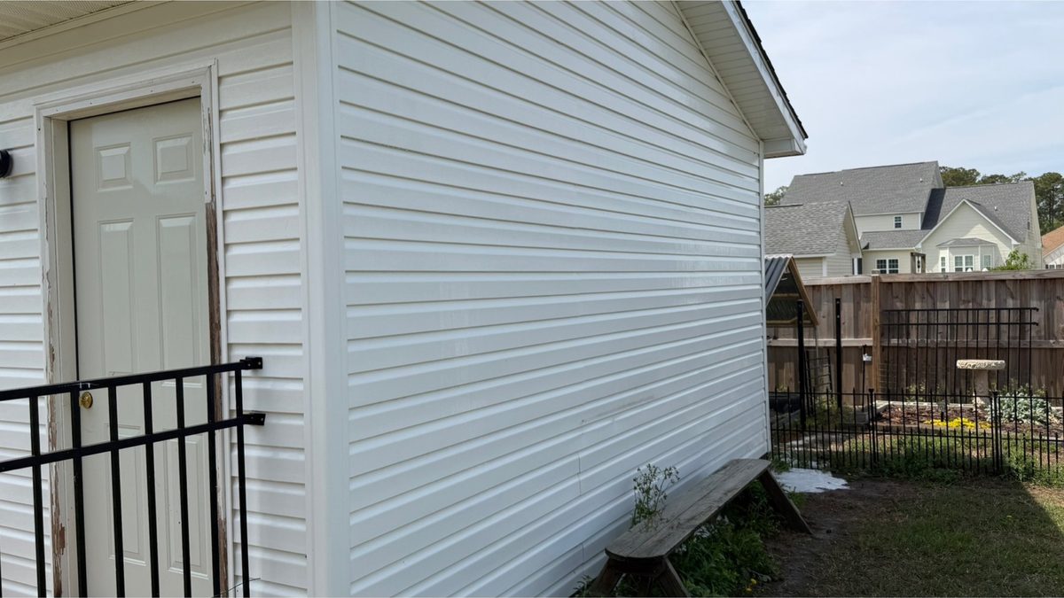 The same siding clean and uniform after soft washing