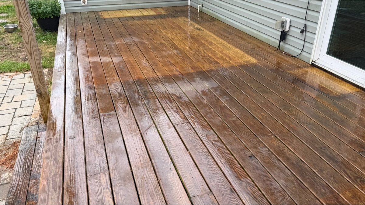 Wood deck boards dulled and greyed by mildew and weathering