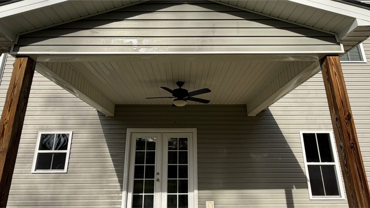 Covered porch ceiling, posts and soffit after cleaning