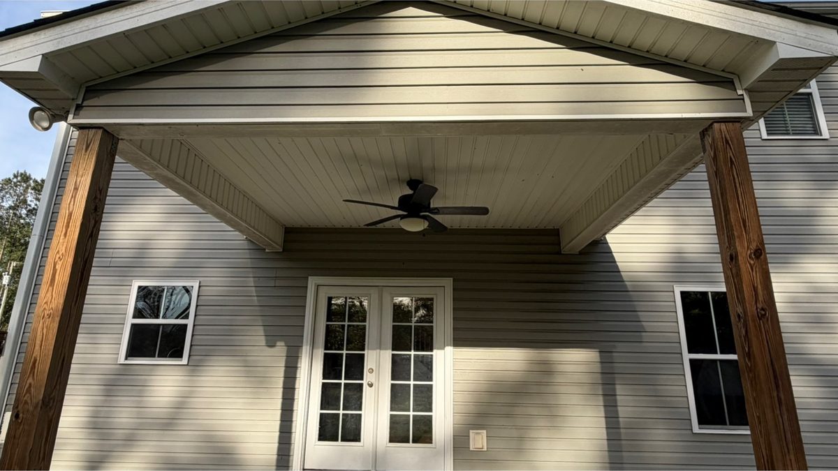 Covered porch ceiling, posts and soffit before cleaning