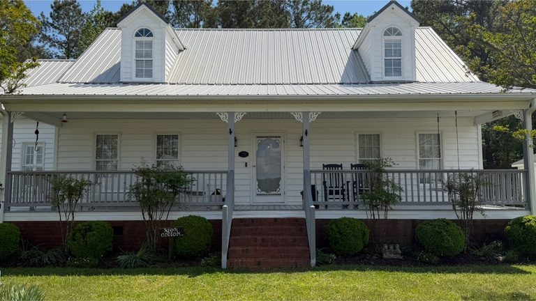 Farmhouse porch and elevation after cleaning