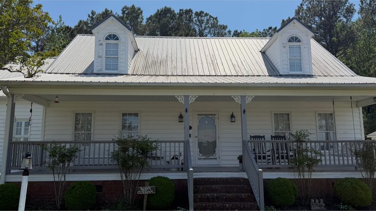 Farmhouse porch and elevation before cleaning