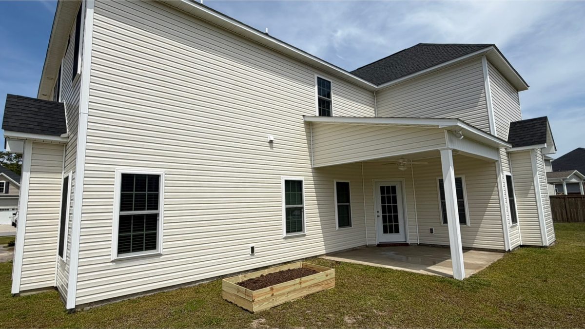 Rear elevation and covered patio after cleaning