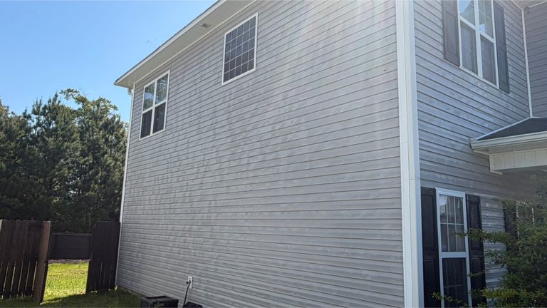 Two-storey siding elevation after cleaning